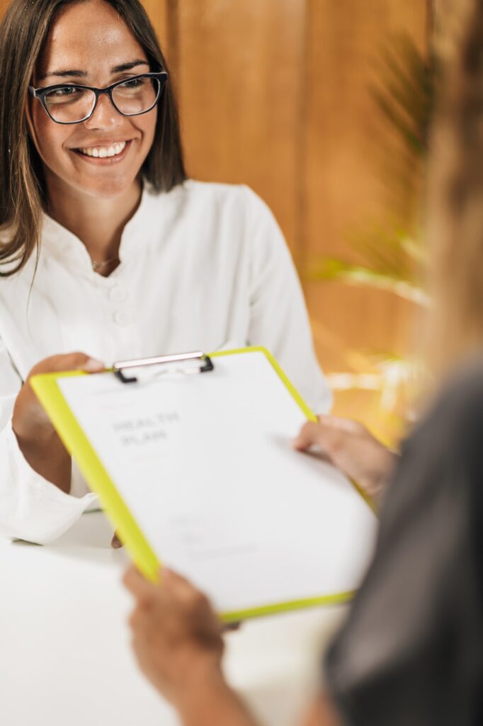 Functional Medicine Doctor Giving Personal Health Plan to the Client